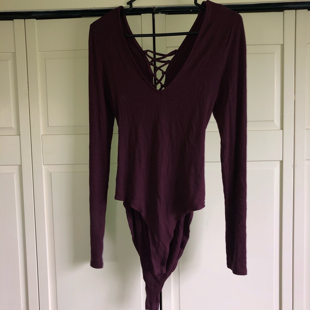 Vneck body suit with cut out lace up back